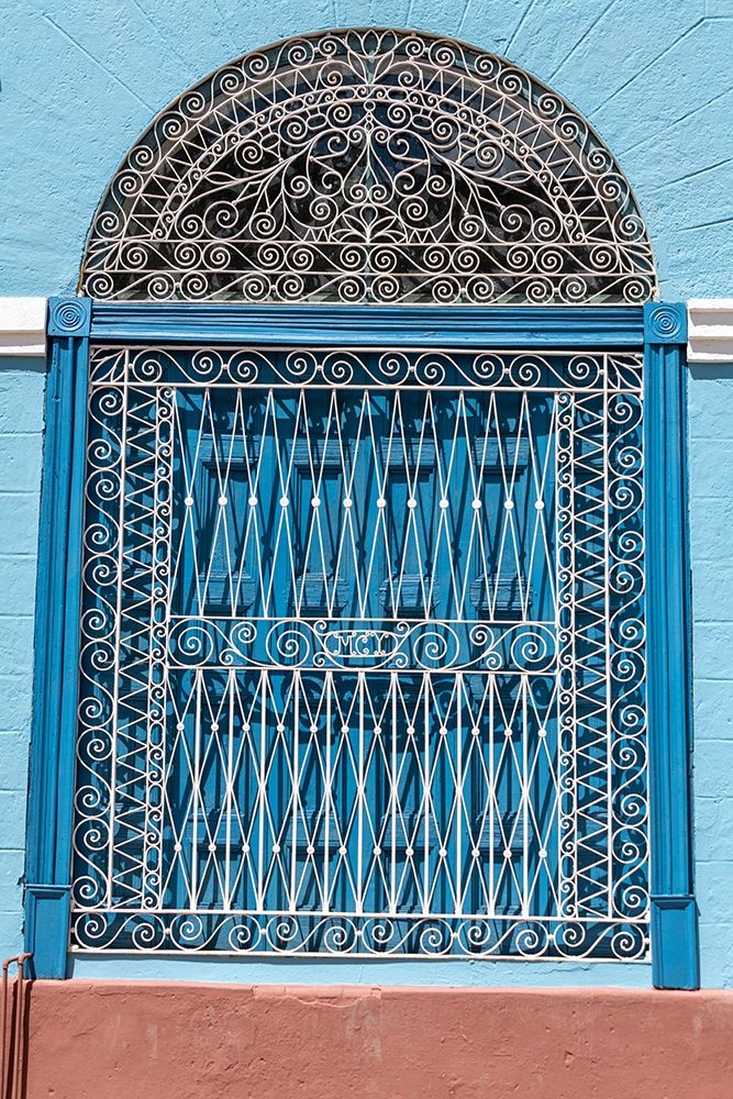 Ornate wrought iron covering on blue wooden window shutters-Trinidad-Cuba